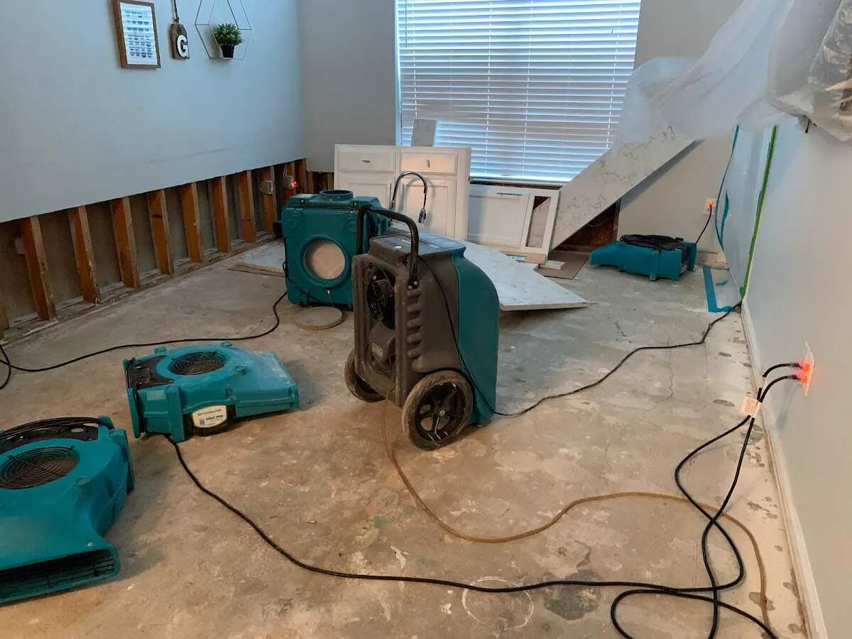 Dehumidifier in flood-cut room for Water Damage Restoration in Bowie